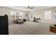 Spacious bedroom with three large windows and comfortable seating area at 154 Calm Water Way, Summerville, SC 29486