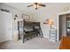 Inviting bedroom featuring a bunk bed, neutral walls, and complementing carpet at 154 Calm Water Way, Summerville, SC 29486