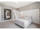Cozy bedroom featuring a bed, neutral walls, wall trim, mirror and complementing carpet at 154 Calm Water Way, Summerville, SC 29486