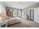 Bright bedroom featuring a bed, neutral walls, two windows allowing natural light and complementing carpet at 154 Calm Water Way, Summerville, SC 29486