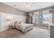 Charming bedroom featuring a bed, neutral walls, two windows allowing natural light and complementing carpet at 154 Calm Water Way, Summerville, SC 29486
