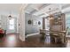 Elegant dining room with coffered ceilings, stylish light fixture, and ample seating at 154 Calm Water Way, Summerville, SC 29486