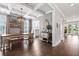 Elegant dining room with coffered ceilings, stylish light fixture, and ample seating at 154 Calm Water Way, Summerville, SC 29486