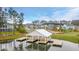 Community dock for relaxing with beautiful architecture on a lake surrounded by colorful houses at 154 Calm Water Way, Summerville, SC 29486