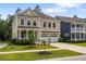 Beautiful two-story home with a welcoming front porch and well-maintained lawn at 154 Calm Water Way, Summerville, SC 29486