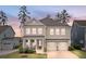 Charming two-story home with a well-manicured front yard and two-car garage at 154 Calm Water Way, Summerville, SC 29486