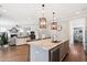 Open concept kitchen with center island and eat in counter and hardwood floors at 154 Calm Water Way, Summerville, SC 29486
