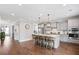 Open kitchen featuring a large island, stainless steel appliances, and hardwood floors at 154 Calm Water Way, Summerville, SC 29486