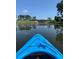 Scenic view from a kayak in the tranquil community lake, framed by lush greenery and a clear blue sky at 154 Calm Water Way, Summerville, SC 29486