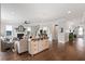 Open concept living room with hardwood floors and shiplap accent wall at 154 Calm Water Way, Summerville, SC 29486