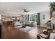 Open concept living room flows into kitchen with hardwood floors at 154 Calm Water Way, Summerville, SC 29486