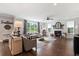 Spacious living room with hardwood floors, fireplace, and large windows at 154 Calm Water Way, Summerville, SC 29486