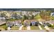 A beautiful aerial street view featuring multiple two-story homes with well manicured lawns and colorful exteriors at 154 Calm Water Way, Summerville, SC 29486