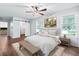 Bright bedroom with natural light from dual windows and a sliding barn door to the walk-in closet at 162 Whippoorwill Dr, Summerville, SC 29483