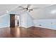 Bedroom with slanted ceilings, hardwood floors, and a barn door to the en suite bathroom at 162 Whippoorwill Dr, Summerville, SC 29483