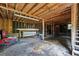 Spacious garage with exposed wood beams and plenty of room for storage at 162 Whippoorwill Dr, Summerville, SC 29483