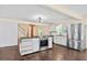 Modern kitchen with stainless steel appliances, a central island, and views into the living area at 162 Whippoorwill Dr, Summerville, SC 29483