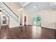 Bright living room with staircase, sliding doors to the backyard, and hardwood floors at 162 Whippoorwill Dr, Summerville, SC 29483