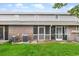 A spacious backyard with screened-in patios offers a serene outdoor living space and an expansive grassy lawn at 1713 Boone Hall Dr # 1082, Charleston, SC 29407