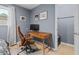 Bedroom desk area features wooden floors, a modern desk and leather chair, and decor at 1713 Boone Hall Dr # 1082, Charleston, SC 29407