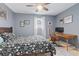 Cozy bedroom features a ceiling fan and a wooden desk with chair for work or study at 1713 Boone Hall Dr # 1082, Charleston, SC 29407