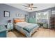 Charming bedroom with a ceiling fan, a window, neutral walls and wood-look flooring at 1713 Boone Hall Dr # 1082, Charleston, SC 29407