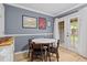 Cozy breakfast nook features a round table, four chairs, and natural light from the French doors to the patio at 1713 Boone Hall Dr # 1082, Charleston, SC 29407
