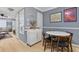 Cozy dining area next to the living room featuring a round dining table and lots of artwork at 1713 Boone Hall Dr # 1082, Charleston, SC 29407