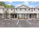 Townhome exterior with assigned parking spots in front of well-maintained facade at 1713 Boone Hall Dr # 1082, Charleston, SC 29407