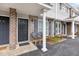 Charming covered front porch with seating area and well-manicured landscaping at 1713 Boone Hall Dr # 1082, Charleston, SC 29407