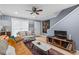 Bright living room with comfortable seating, stylish decor, and modern ceiling fan at 1713 Boone Hall Dr # 1082, Charleston, SC 29407