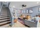 Cozy living room with hardwood floors and decorative staircase, bathed in natural light at 1713 Boone Hall Dr # 1082, Charleston, SC 29407
