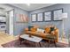Inviting living room showcasing a decorative fireplace, a comfortable couch and lots of artwork at 1713 Boone Hall Dr # 1082, Charleston, SC 29407
