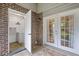 Outdoor patio featuring brick accents and multiple entry points, laundry room visible at 1713 Boone Hall Dr # 1082, Charleston, SC 29407