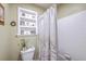 Bathroom featuring a decorative shower curtain and toilet with an adjacent storage shelf at 18 Indigo Ln, Goose Creek, SC 29445