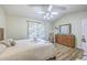Bedroom featuring a wood dresser, ceiling fan, curtains and a decorative bed spread at 18 Indigo Ln, Goose Creek, SC 29445