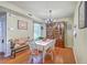 Bright dining room with hardwood floors, a chandelier, and a wooden hutch, perfect for Gathering meals at 18 Indigo Ln, Goose Creek, SC 29445