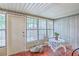 Bright sunroom features red-tiled flooring, windows and a table with chairs at 18 Indigo Ln, Goose Creek, SC 29445