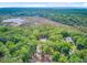 An expansive aerial view capturing the property's serene setting near waterways and dense foliage at 18 Tupelo Trl, Edisto Island, SC 29438