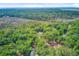 Scenic aerial view of a homesite surrounded by lush trees near a marshy waterway in Edisto Island, SC at 18 Tupelo Trl, Edisto Island, SC 29438