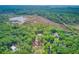 Wide aerial shot of multiple homesites surrounded by marshy waterways in Edisto Island, South Carolina at 18 Tupelo Trl, Edisto Island, SC 29438