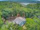Aerial of the elevated home nestled amongst lush trees and natural surroundings near Edisto Island, SC at 18 Tupelo Trl, Edisto Island, SC 29438