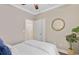Relaxing bedroom features a bright closet, ensuite access, and a contemporary round mirror to enjoy at 18 Tupelo Trl, Edisto Island, SC 29438