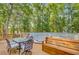 Wooden deck featuring dining set and furniture with views of surrounding greenery for relaxation and entertainment at 18 Tupelo Trl, Edisto Island, SC 29438