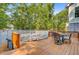 Outdoor deck with table and chairs providing a perfect space for dining, entertaining, and relaxation at 18 Tupelo Trl, Edisto Island, SC 29438