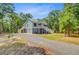 Attractive raised beach house with a lush tree lined yard, and private drive at 18 Tupelo Trl, Edisto Island, SC 29438
