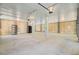 Large open garage featuring a large black water tank, and wooden slat walls at 18 Tupelo Trl, Edisto Island, SC 29438
