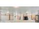 Spacious garage area featuring a large black water tank, and wooden slat walls at 18 Tupelo Trl, Edisto Island, SC 29438