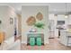 Hallway featuring decor, which leads into a modern kitchen with stainless steel appliances at 18 Tupelo Trl, Edisto Island, SC 29438