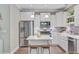 Bright kitchen featuring stainless steel appliances, white cabinets, and a center island at 18 Tupelo Trl, Edisto Island, SC 29438